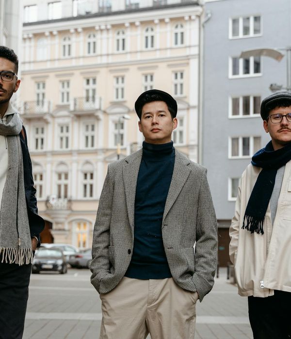 Group of diverse language educators collaborating in modern office space